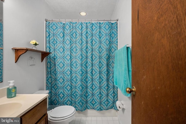 bathroom featuring tile patterned floors, walk in shower, toilet, vanity, and a textured ceiling