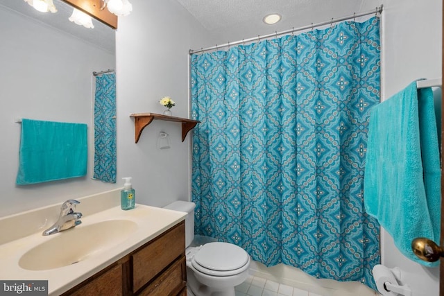 bathroom with toilet, tile patterned floors, vanity, a textured ceiling, and a shower with shower curtain