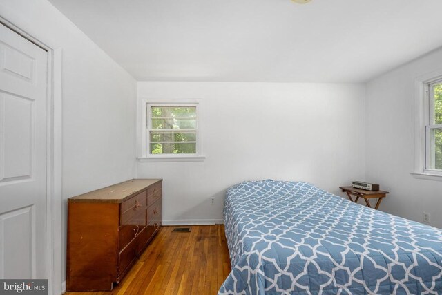 bedroom with light wood-type flooring