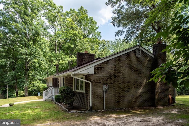 view of property exterior featuring a lawn