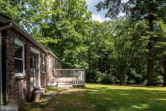 view of yard with a wooden deck