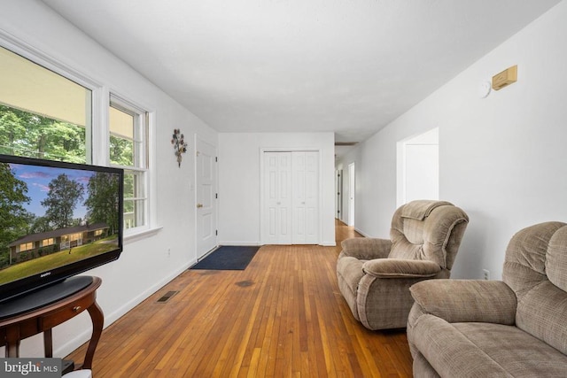 sitting room with hardwood / wood-style floors