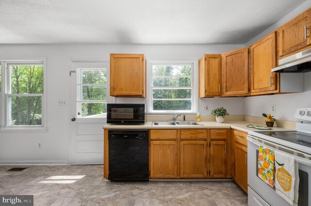 kitchen featuring black appliances and sink