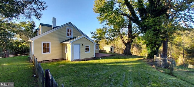 back of house with a yard