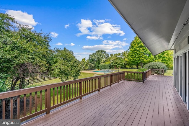 deck featuring a lawn