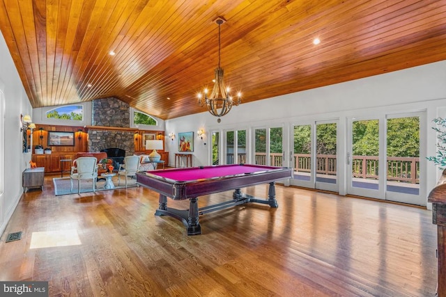 playroom with wooden ceiling, plenty of natural light, billiards, and a stone fireplace