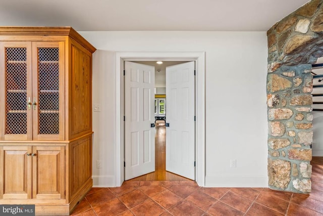 interior space with dark tile patterned floors