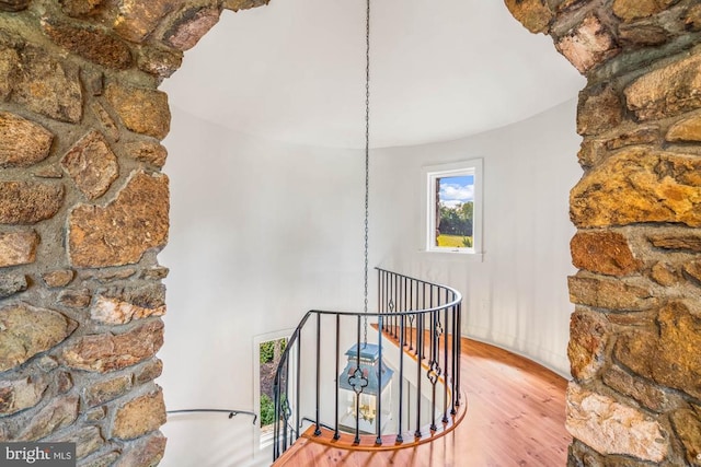 interior space with an inviting chandelier and hardwood / wood-style flooring