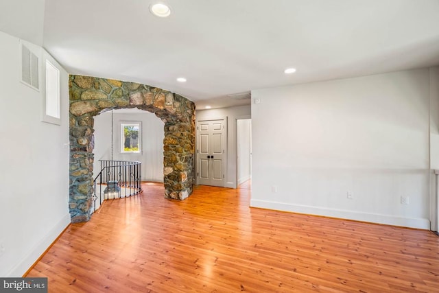 unfurnished room with light wood-type flooring