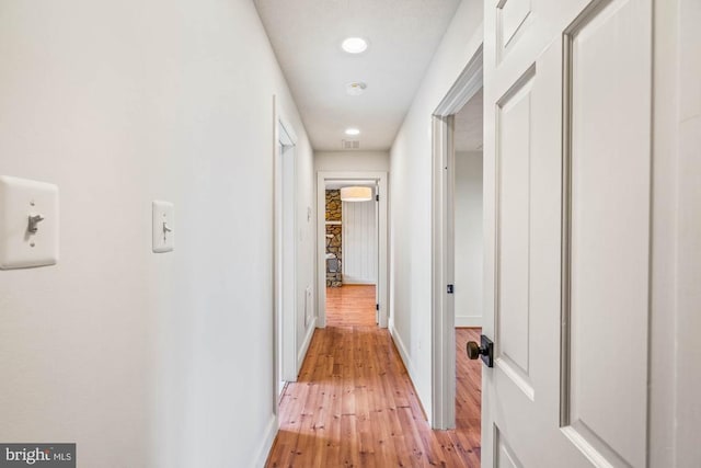 corridor featuring light hardwood / wood-style floors