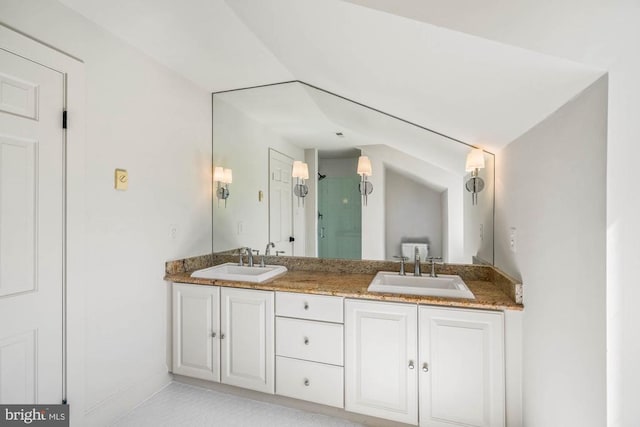 bathroom featuring vanity and a shower with door