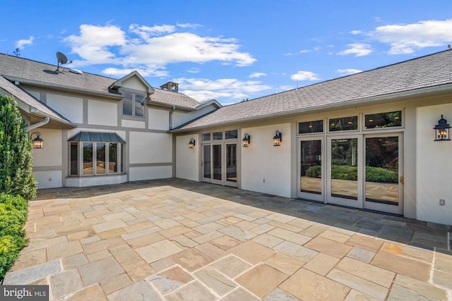 rear view of house featuring french doors and a patio