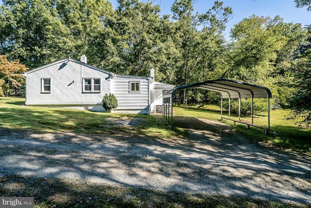 exterior space featuring a lawn and a carport