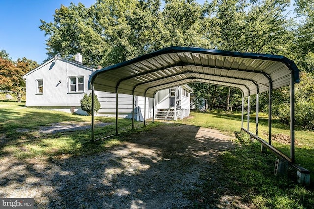 view of vehicle parking with a lawn and a carport