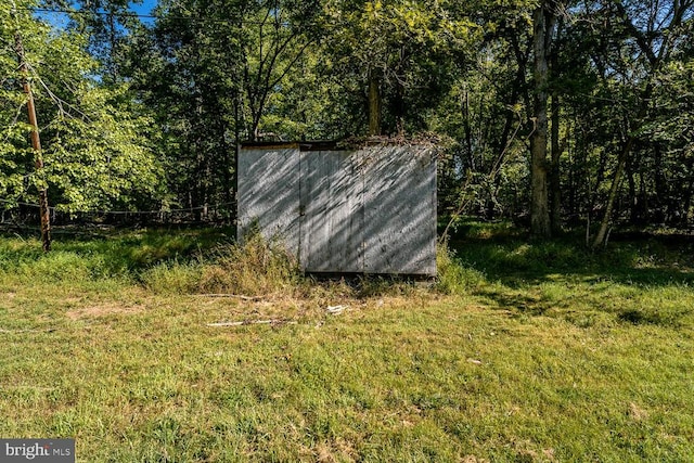 view of outdoor structure with a lawn