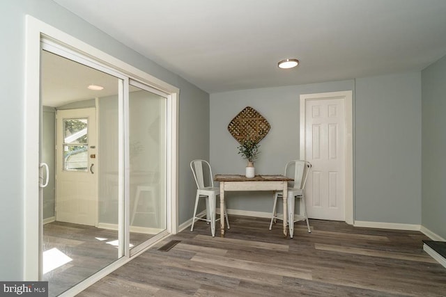 interior space with dark wood-type flooring