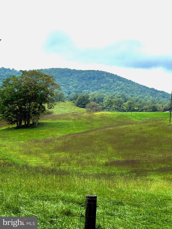 property view of mountains featuring a rural view