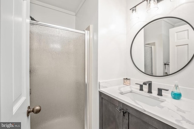 bathroom with walk in shower and vanity