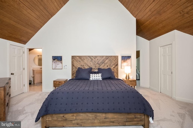 bedroom featuring light colored carpet, connected bathroom, high vaulted ceiling, and wooden ceiling