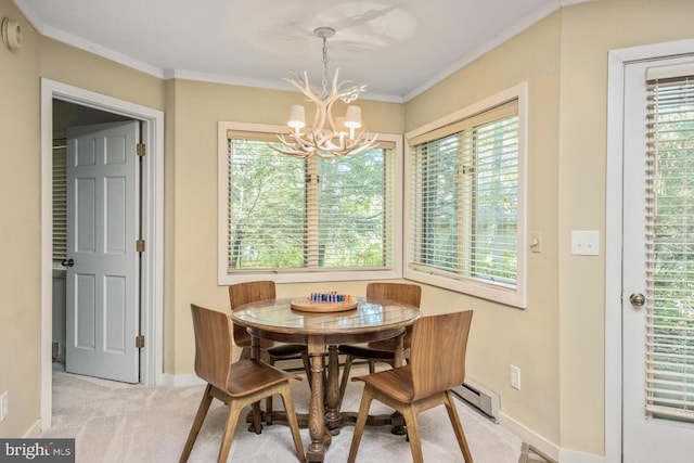 dining space featuring light carpet, a wealth of natural light, a notable chandelier, and ornamental molding