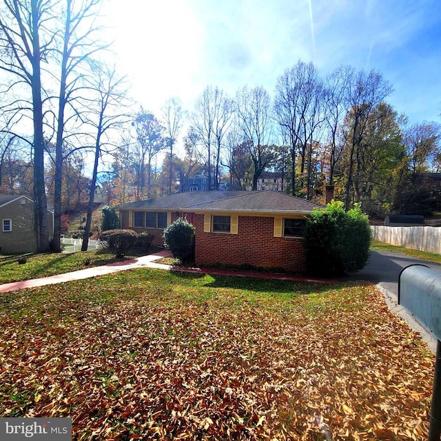 view of side of home featuring a yard