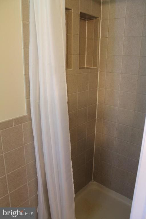 bathroom with a shower with curtain