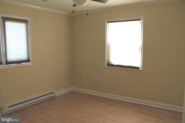 unfurnished room featuring ornamental molding, ceiling fan, a baseboard heating unit, and light hardwood / wood-style flooring