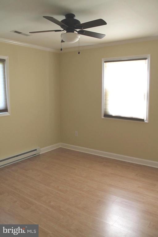 spare room with ceiling fan, light hardwood / wood-style flooring, and ornamental molding