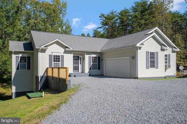 single story home featuring a garage and a front lawn