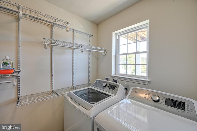 washroom with washer and dryer