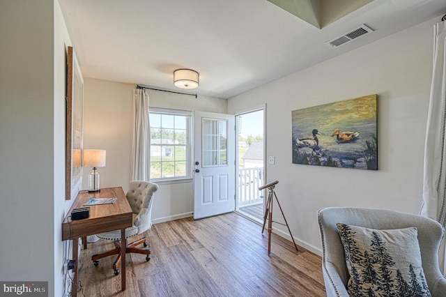 home office with hardwood / wood-style floors