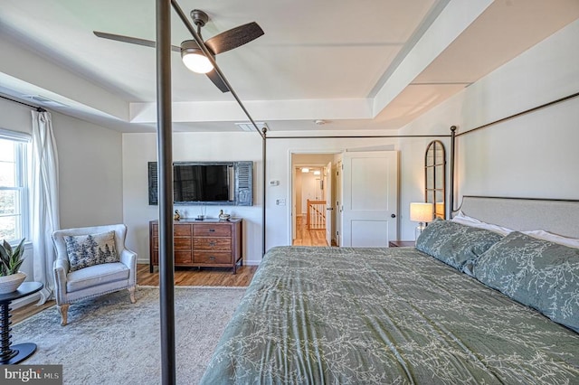 bedroom featuring hardwood / wood-style flooring and ceiling fan