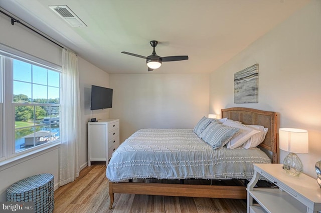 bedroom featuring light wood-type flooring and ceiling fan