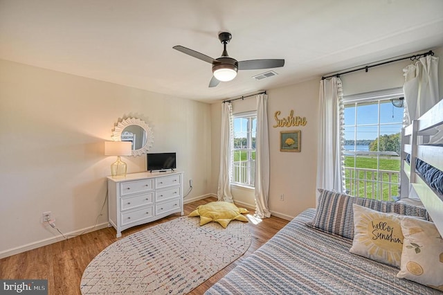 bedroom featuring light hardwood / wood-style flooring and ceiling fan