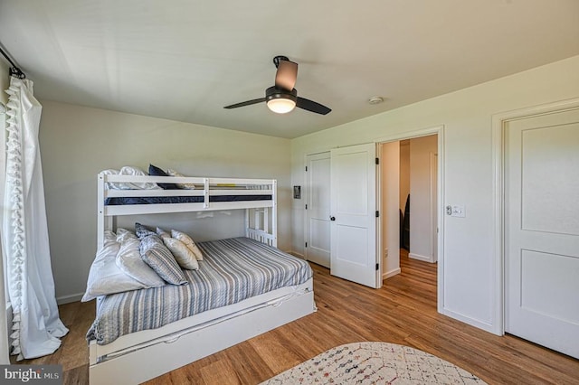 bedroom featuring ceiling fan and hardwood / wood-style floors