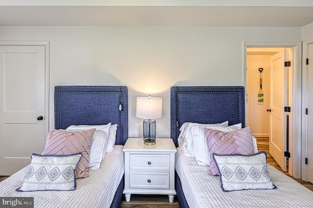 bedroom featuring dark wood-type flooring