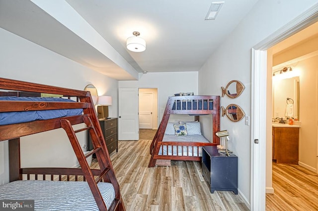 bedroom with light hardwood / wood-style flooring