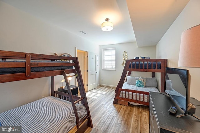 bedroom with light hardwood / wood-style floors