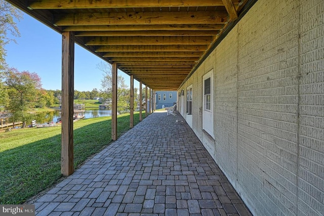 view of patio featuring a water view