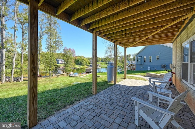 view of patio featuring a water view