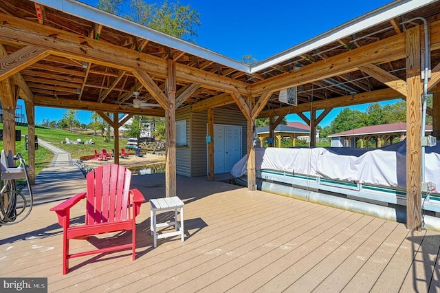 dock area with a gazebo and a wooden deck