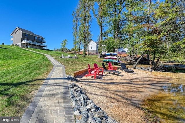 view of property's community with a lawn