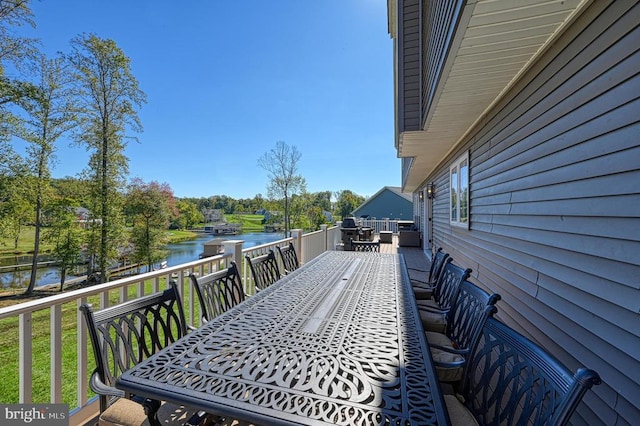 wooden deck with a water view