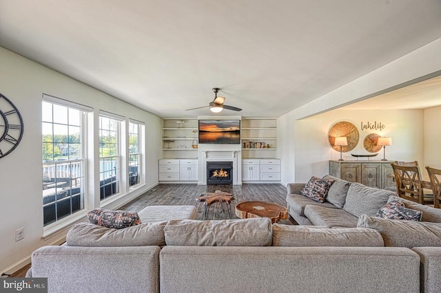 living room featuring ceiling fan and hardwood / wood-style floors