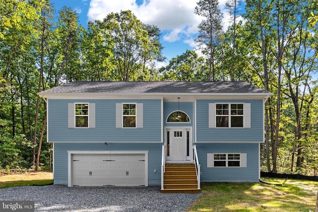 split foyer home featuring a garage