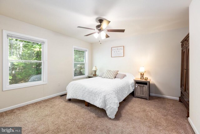 carpeted bedroom featuring ceiling fan