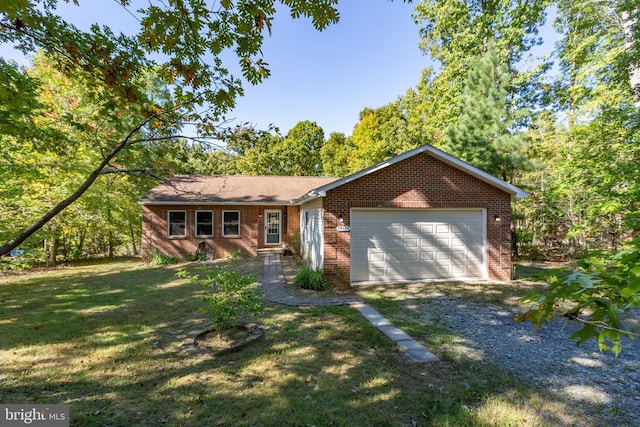 single story home with a front yard and a garage