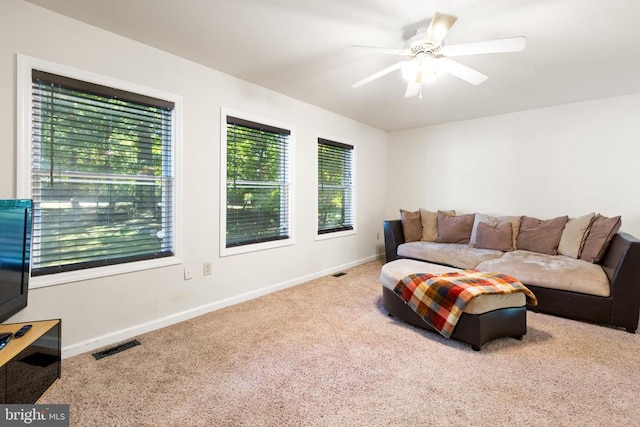 living room with carpet flooring and ceiling fan