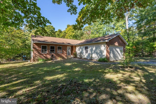 single story home featuring a front lawn and a garage