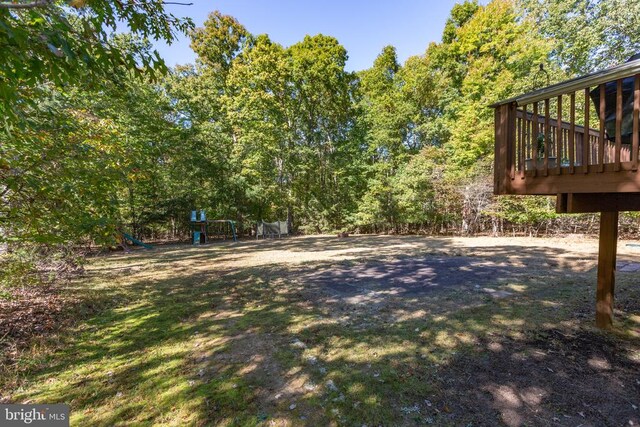 view of yard featuring a wooden deck